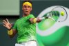 Rafael Nadal hits a forehand on a shoulder high ball at Key Biscayne 2011[1].JPG